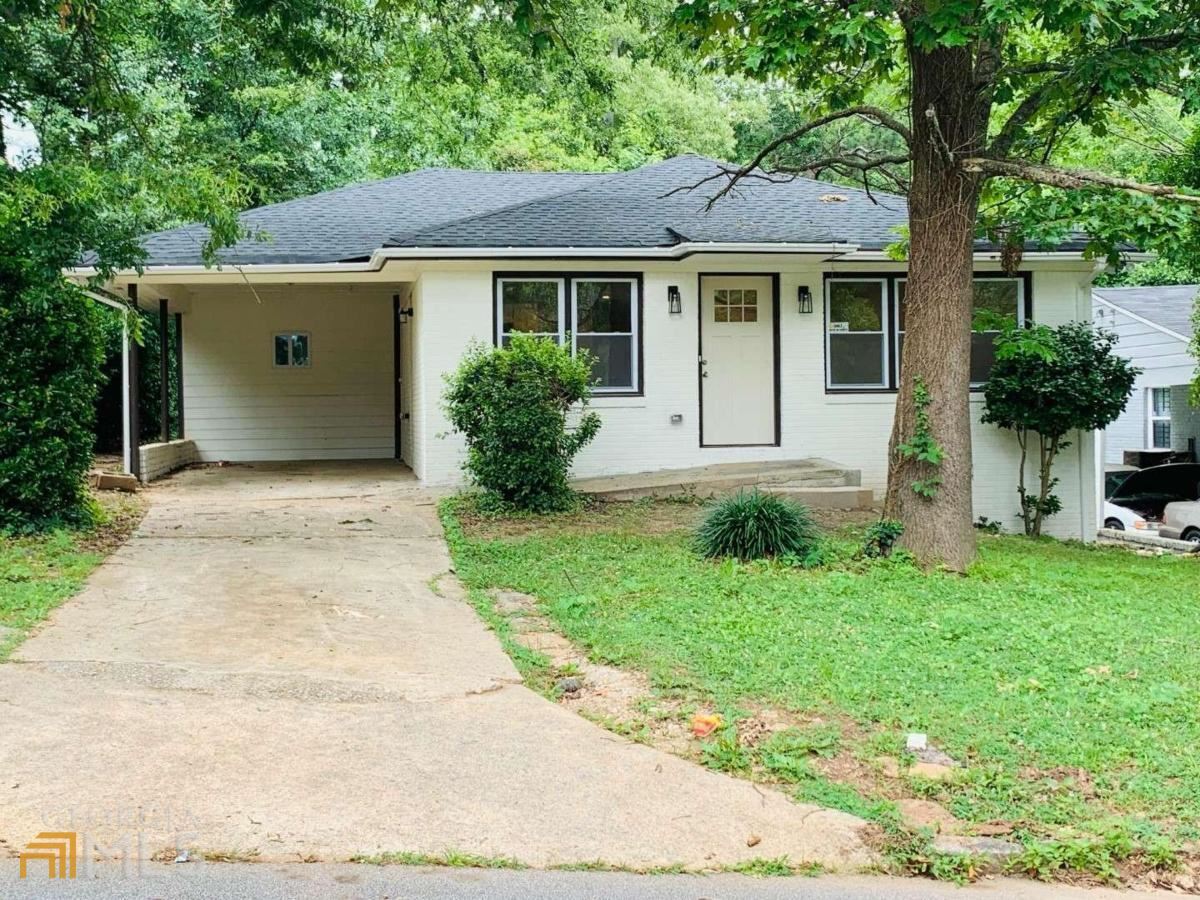 364 Brooks Avenue Southwest Atlanta, GA 30310 - Photo 1 of 21 a front view of a house with a garden
