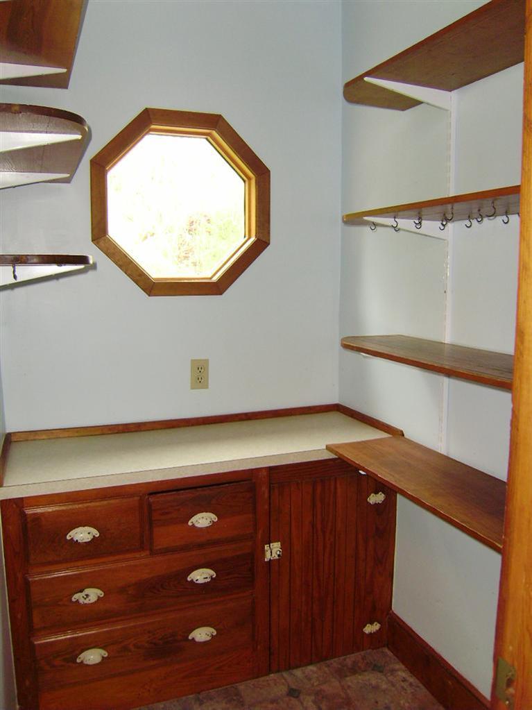 19 Shore Road Bourne, MA 02532 - Photo 15 of 21 a view of storage and utility room with washer and dryer