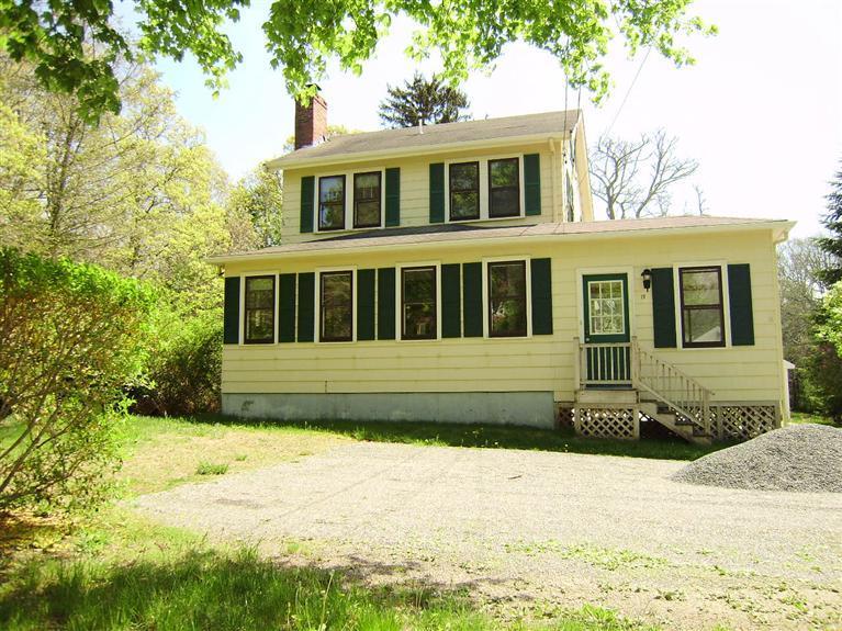 19 Shore Road Bourne, MA 02532 - Photo 19 of 21 a front view of a house with a yard