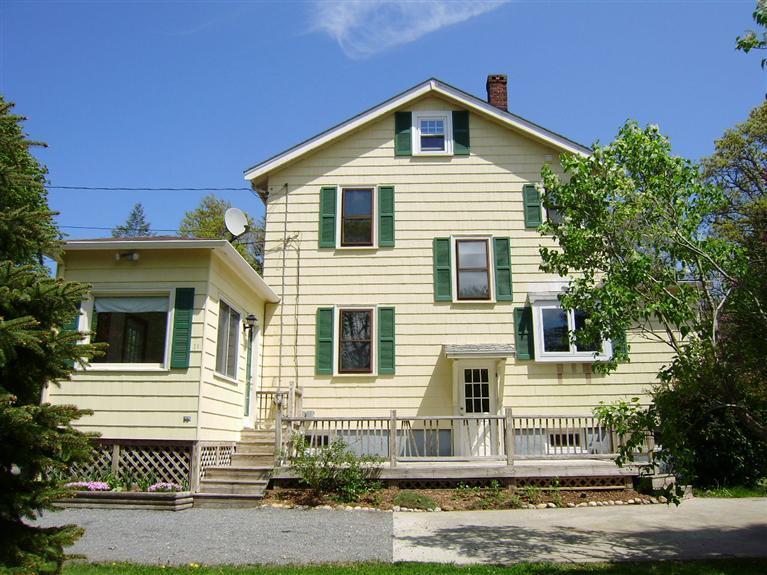19 Shore Road Bourne, MA 02532 - Photo 2 of 21 a front view of a house with a yard