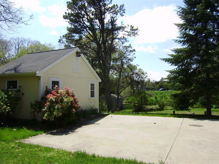 19 Shore Road Bourne, MA 02532 - Photo 21 of 21 a front view of house with garden