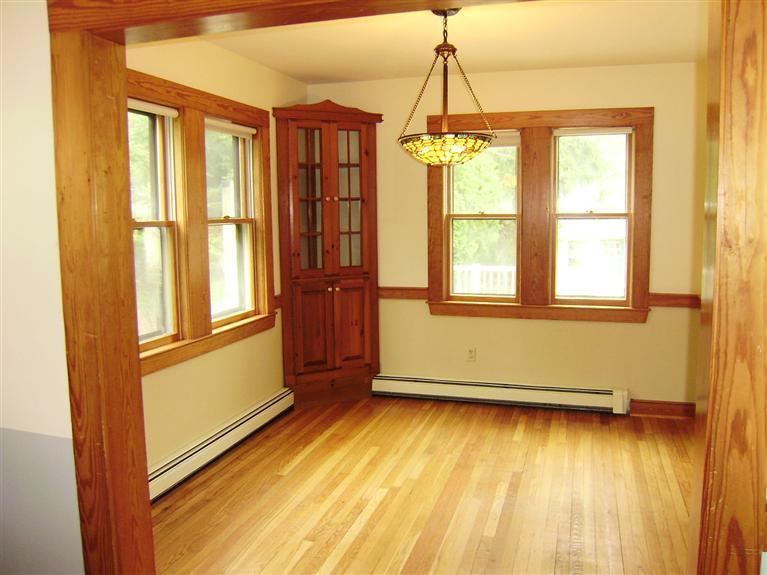 19 Shore Road Bourne, MA 02532 - Photo 4 of 21 a view of an empty room with a window and wooden floor