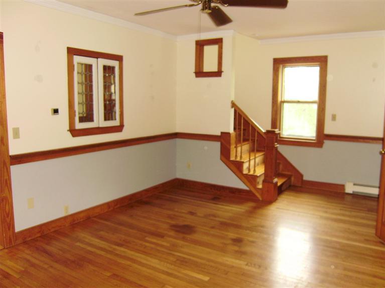 19 Shore Road Bourne, MA 02532 - Photo 5 of 21 a view of an empty room with window and wooden floor