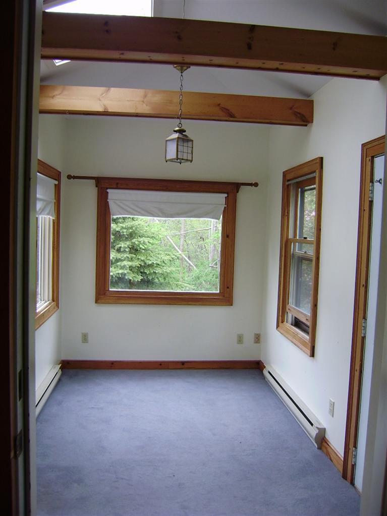 19 Shore Road Bourne, MA 02532 - Photo 8 of 21 a view of an empty room with a window