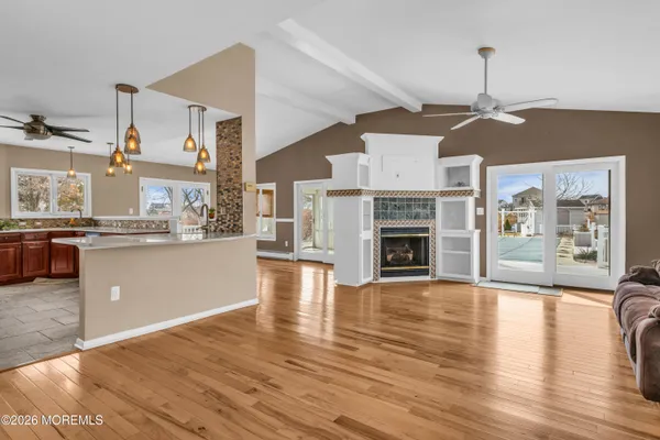 a living room with furniture fireplace and flat screen tv