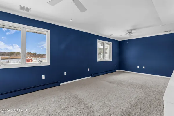 a view of room with window and ceiling fan