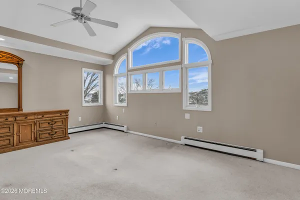 an aerial view of a house with a lake view