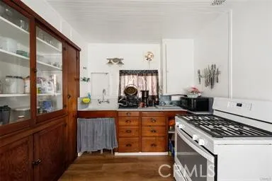 a kitchen with a stove and a sink