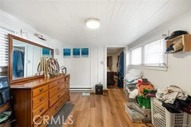 a bedroom with furniture and a window