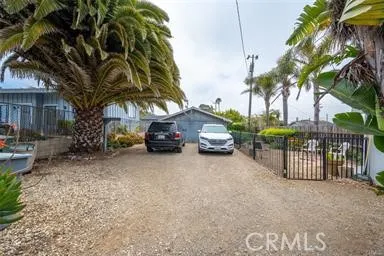 a view of a car park in front of a house