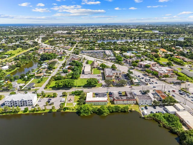 an aerial view of city and lake