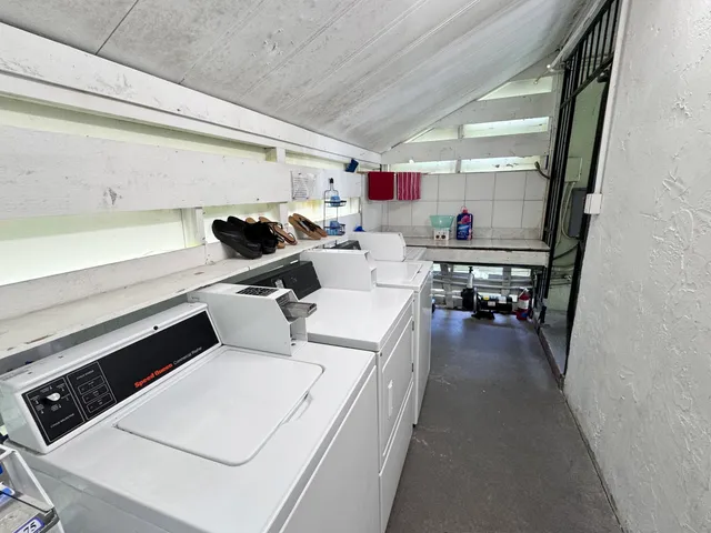 a bathroom with a sink a toilet and bathtub