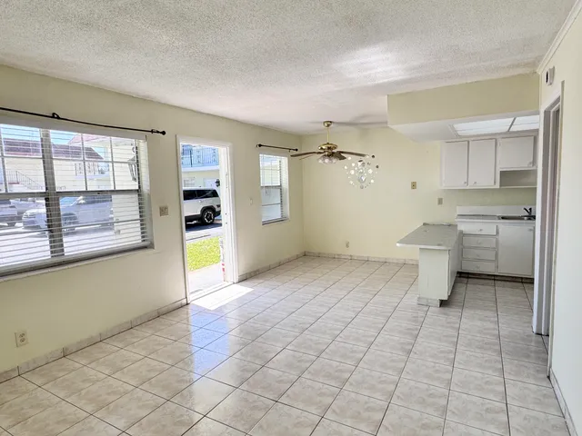 a view of a kitchen with electric appliances