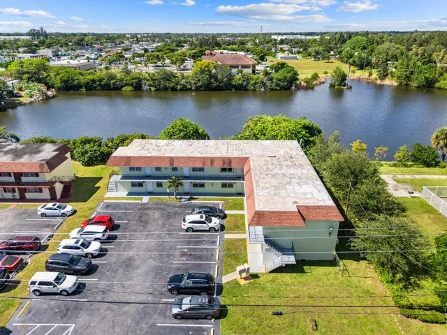 an aerial view of a house with a lake view