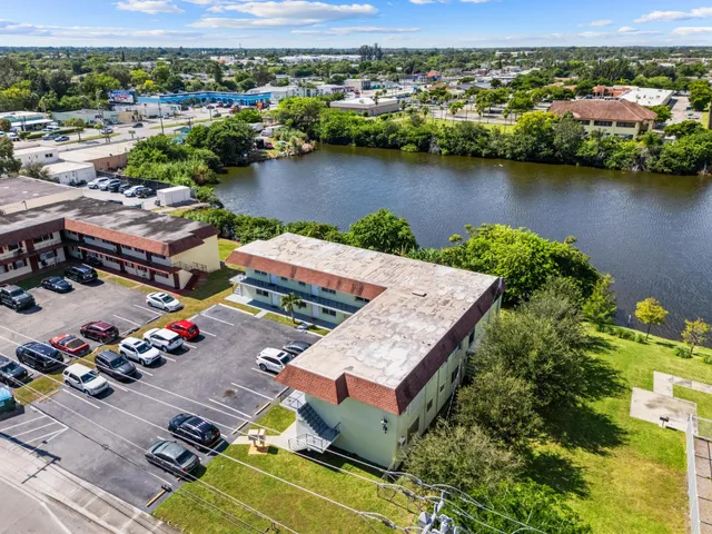 an aerial view of a house with a lake view