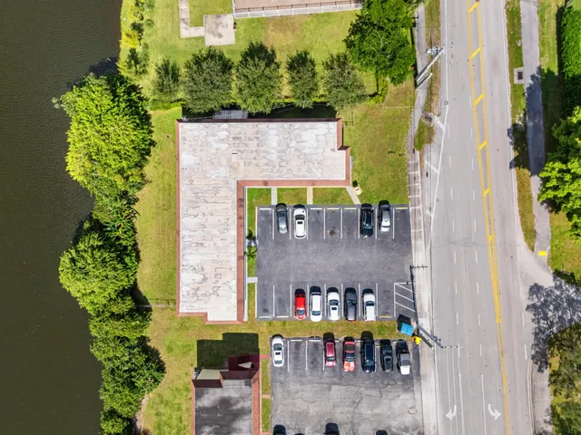an aerial view of a house with a yard and potted plants