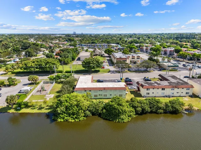 an aerial view of a house with a yard lake view