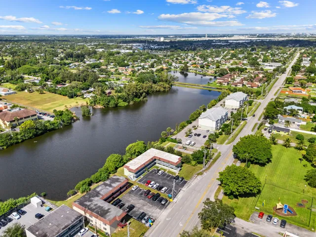 an aerial view of a house with a lake view
