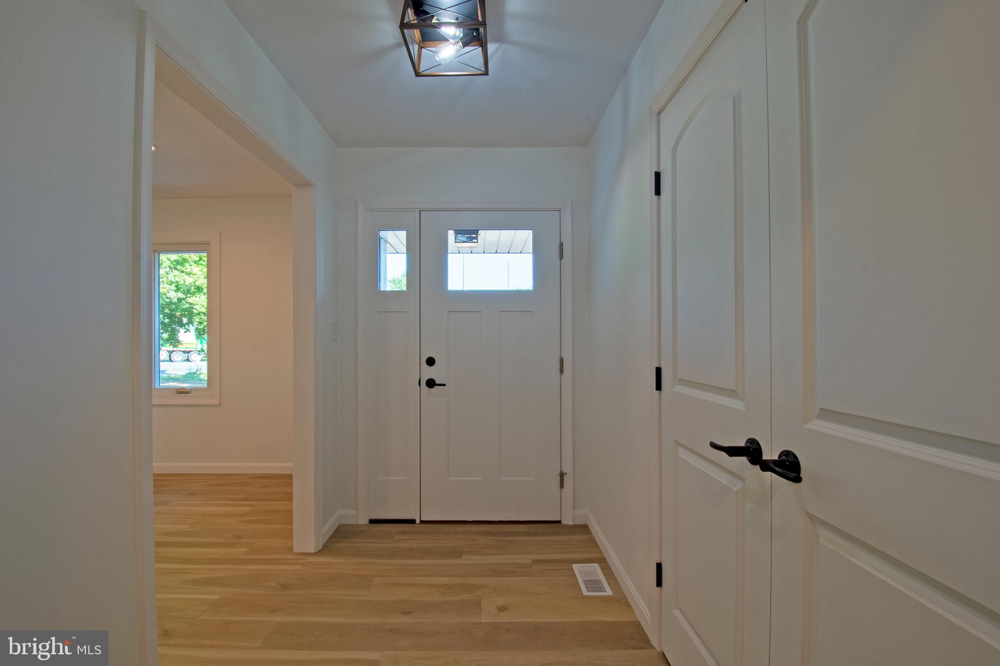 26854 Broadkill Road Milton, DE 19968 - Photo 31 of 56 a view of a hallway with front door