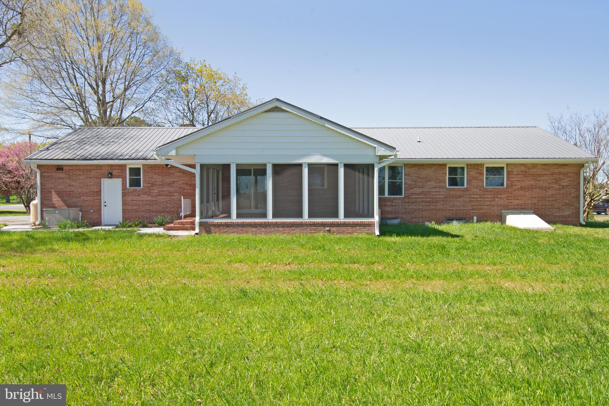 26854 Broadkill Road Milton, DE 19968 - Photo 7 of 56 front view of a house with a yard