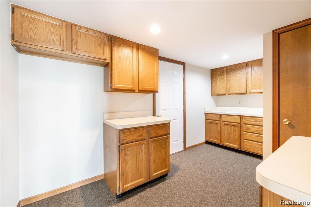19130 Meridian Road Grosse Ile, MI 48138 - Photo 29 of 49 Butlers pantry behind the kitchen is also an entryway from the front 2 car attached garage. Great extra storage.