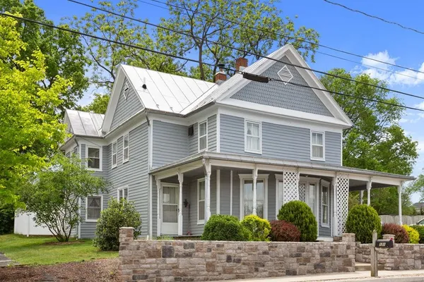 a view of a house with a yard and plants