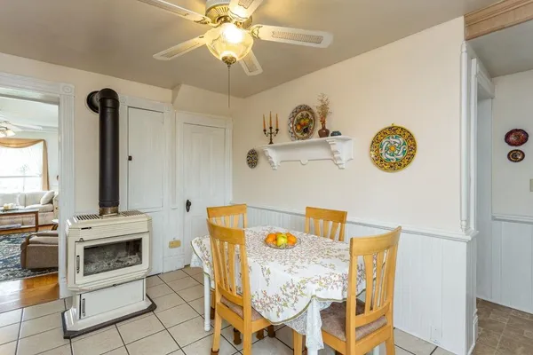 a view of a kitchen with furniture and chandelier
