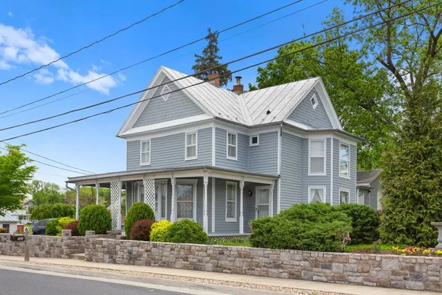 a front view of a house with garden