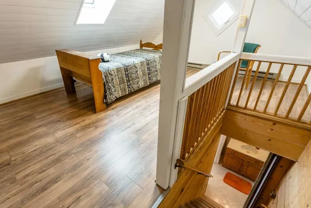 a view of a livingroom with furniture and staircase