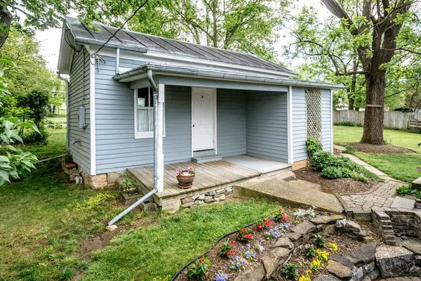 a front view of a house with garden