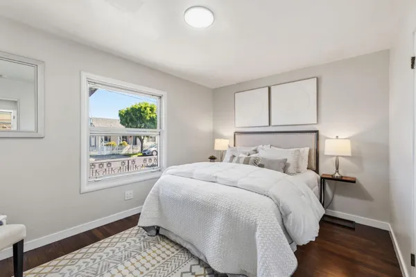 a bedroom with a bed and window