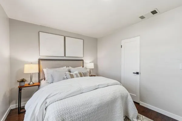 a bedroom with bed and a window