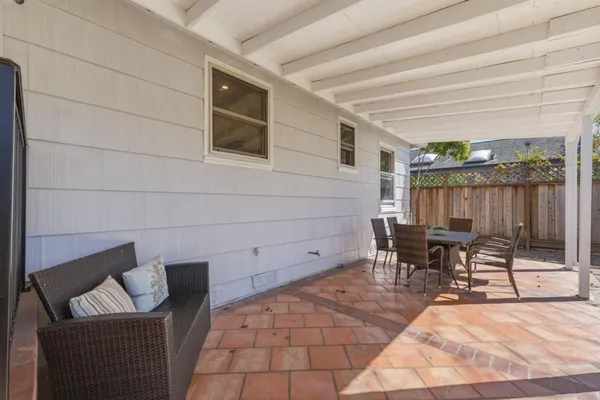 a view of back yard with wooden fence