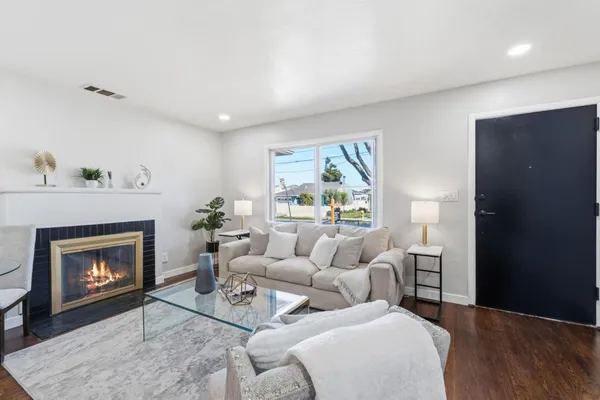 a view of room with livingroom and hardwood floor