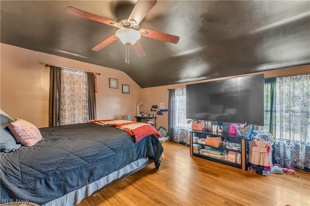 3962 Grosvenor Road South Euclid, OH 44118 - Photo 13 of 27 Wood-finish flooring creates a warm ambiance in this room, complemented by a ceiling fan with integrated lighting