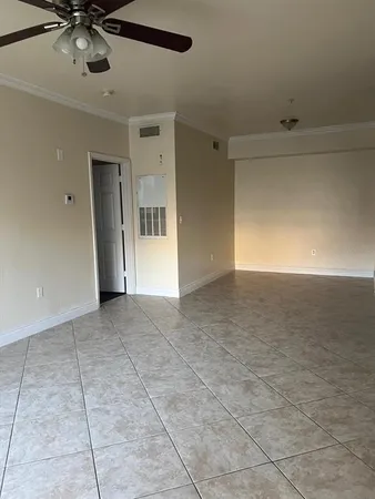 a kitchen with stainless steel appliances granite countertop a sink and a refrigerator