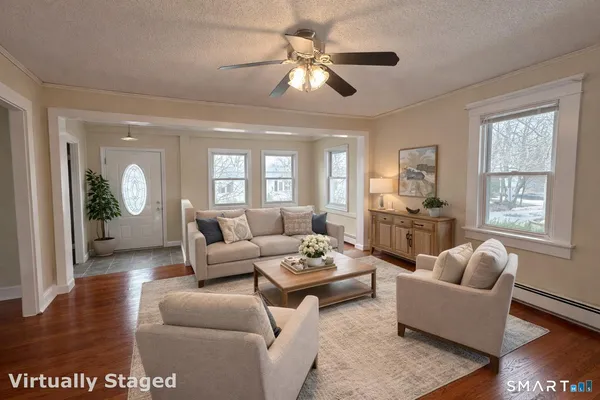 a living room with furniture and a large window