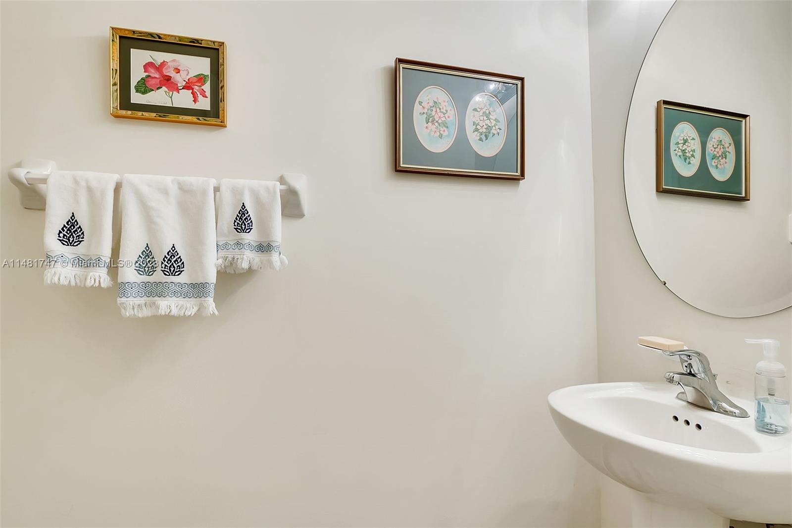 15073 Southwest 119TH Lane Miami, FL 33196 - Photo 16 of 25 a bathroom with a sink and a mirror