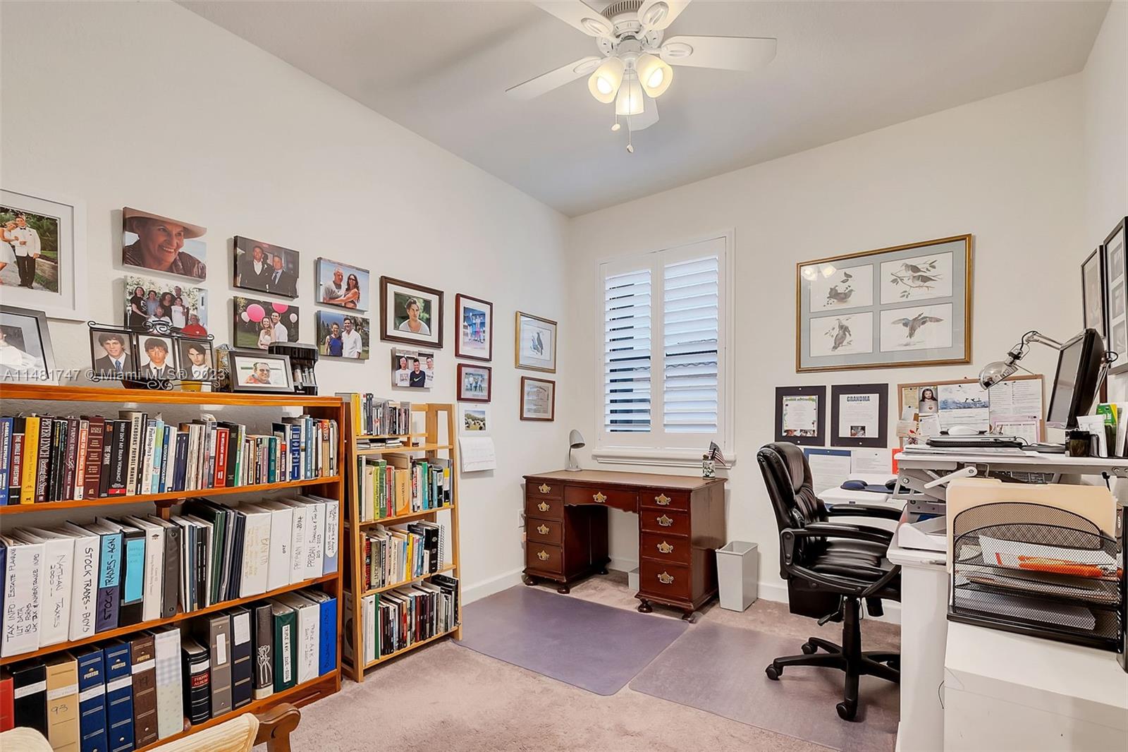 15073 Southwest 119TH Lane Miami, FL 33196 - Photo 18 of 25 a view of a workspace with bookshelf