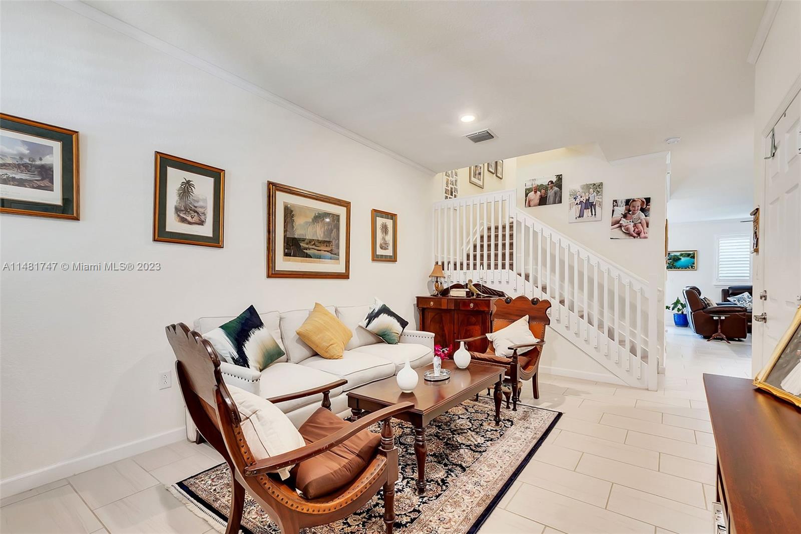 15073 Southwest 119TH Lane Miami, FL 33196 - Photo 2 of 25 a living room with furniture and a table