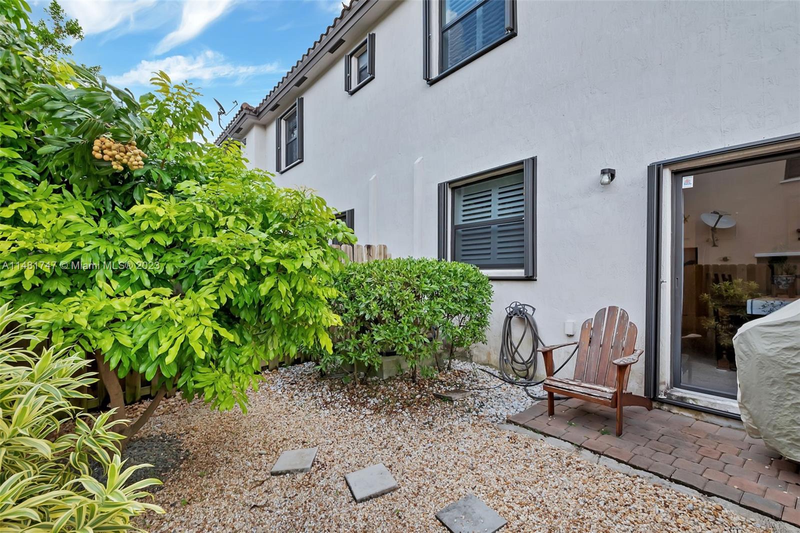 15073 Southwest 119TH Lane Miami, FL 33196 - Photo 25 of 25 a view of a house with backyard and sitting area