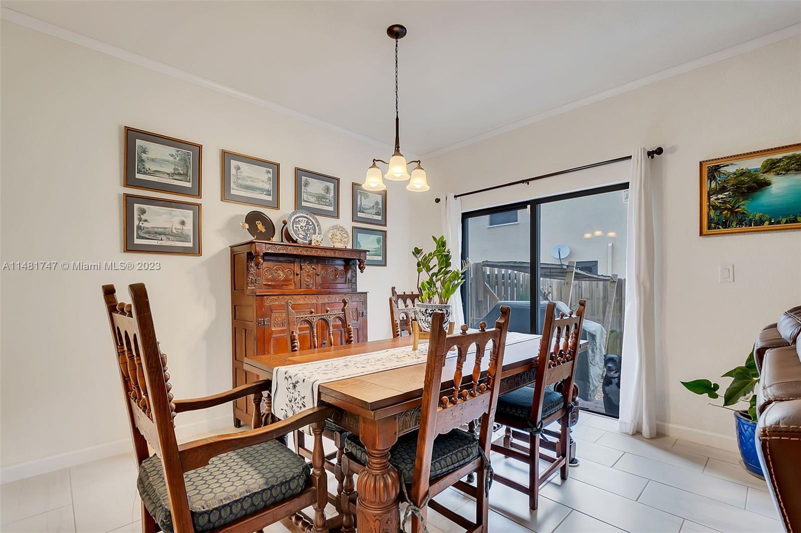 15073 Southwest 119TH Lane Miami, FL 33196 - Photo 5 of 25 a dining room with furniture and window