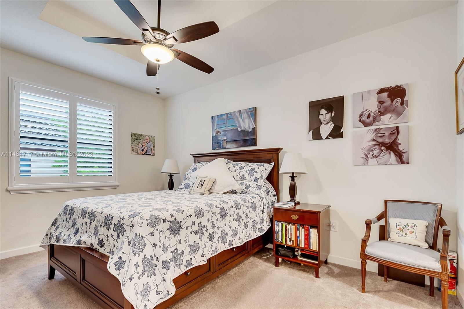 15073 Southwest 119TH Lane Miami, FL 33196 - Photo 6 of 25 a bedroom with a bed and furniture