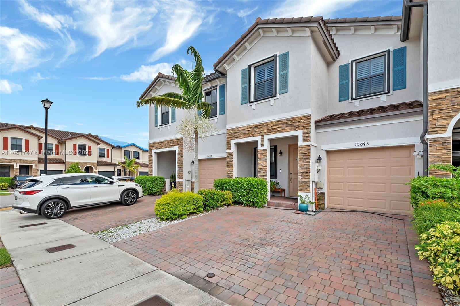 15073 Southwest 119TH Lane Miami, FL 33196 - Photo 10 of 25 a front view of multiple houses with yard