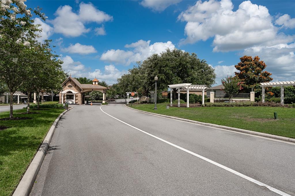 9224 Southwest 60th Ct Road Ocala, FL 34476 - Photo 52 of 55 a view of a street with a houses in the background
