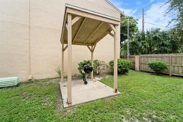 a view of yard with patio