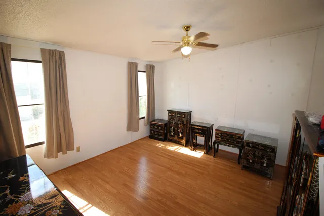a view of a livingroom with furniture and a window