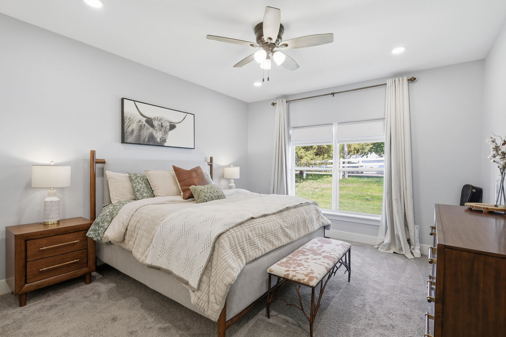 6779 Genesis Way Bettendorf, IA 52722 - Photo 18 of 36 a bedroom with a bed a couch and a window