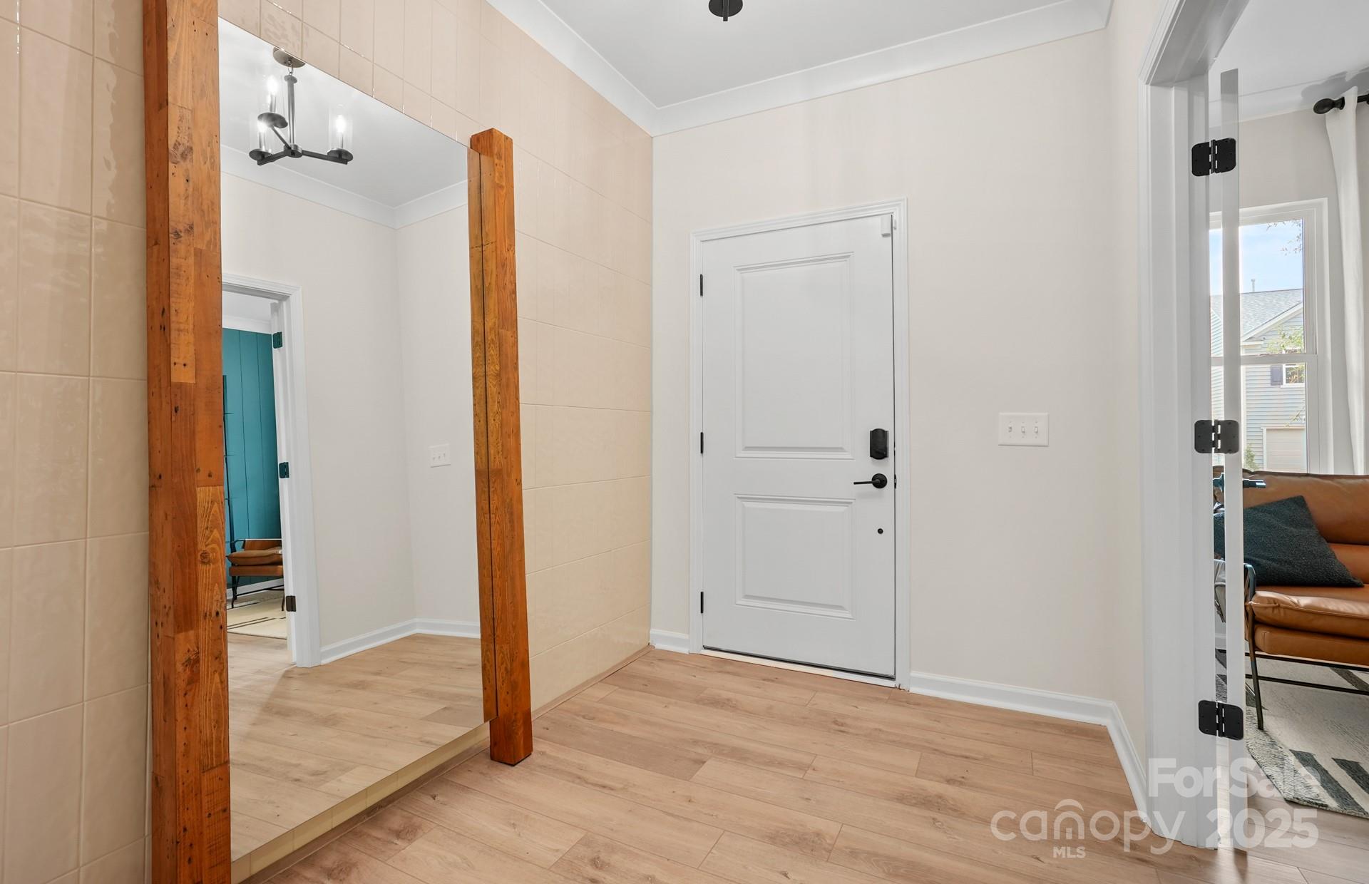 a view of entryway with wooden floor