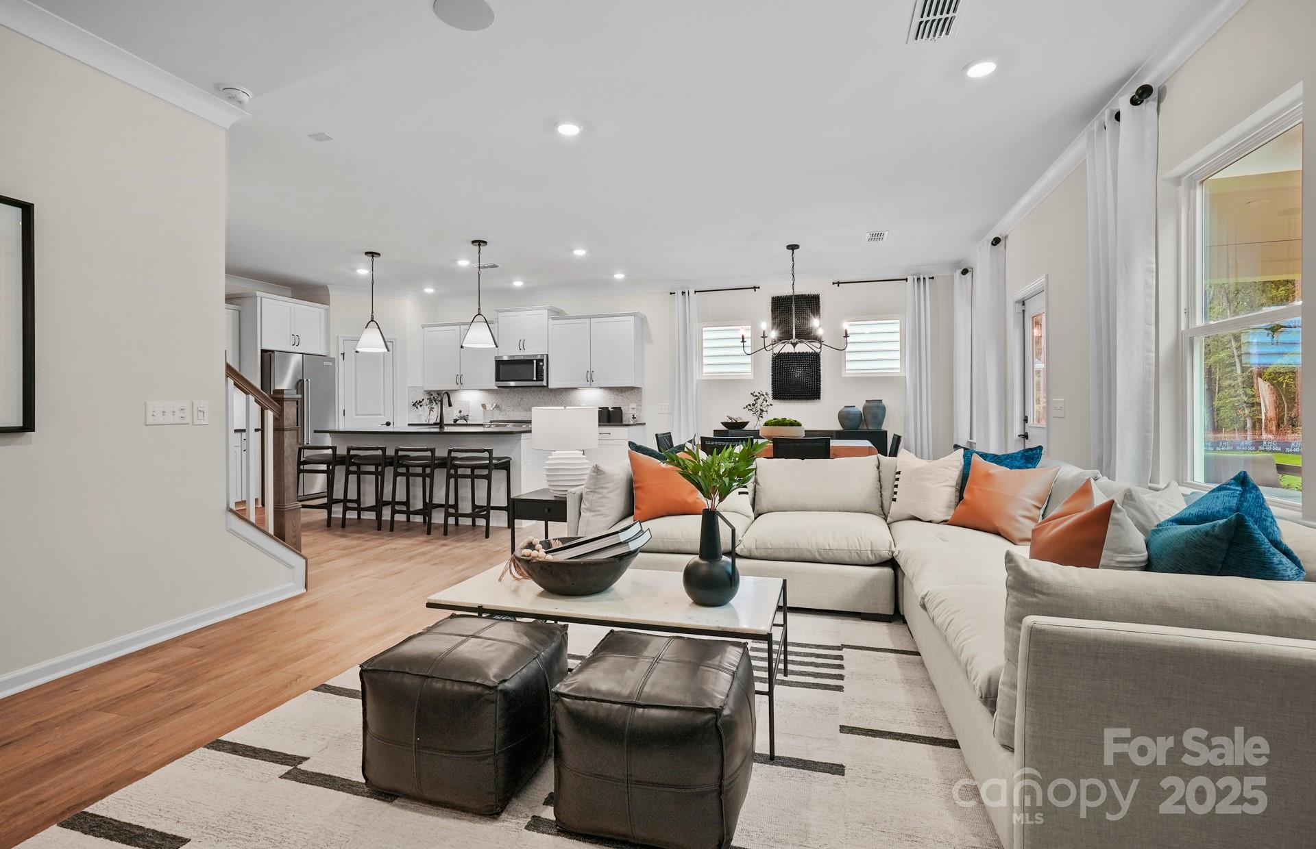 12016 Rails Court, Unit 516 Charlotte, NC 28278 - Photo 18 of 39 a living room with furniture and kitchen view